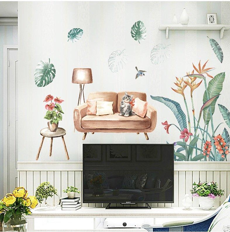 Decal dán tường mèo ngồi trên sofa và lá xanh